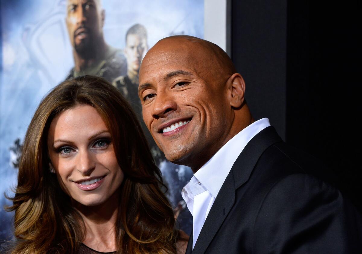 Dwayne Johnson and Lauren Hashian arrive at the premiere of "G.I. Joe: Retaliation" at the TCL Chinese Theatre on March 28, 2013.
