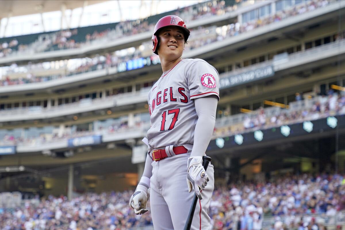 Angels two-star Shohei Ohtani smiles at the fans as he waits to bat on July 24