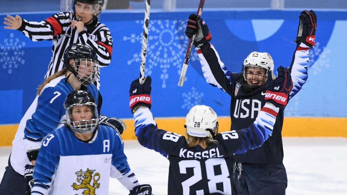 U.S. Danielle Cameranesi (R) celebrates after scoring a goal in the women's ice hockey semifinal game between the United States and Finland.