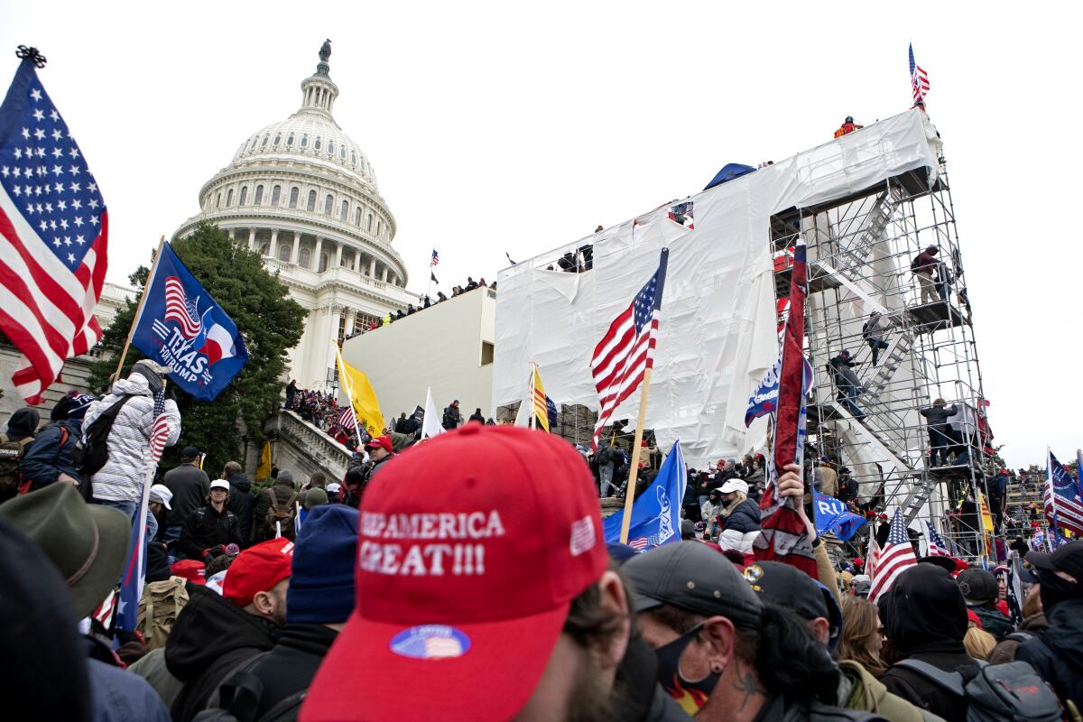 A mob surrounds the U.S. Capitol on Jan. 6