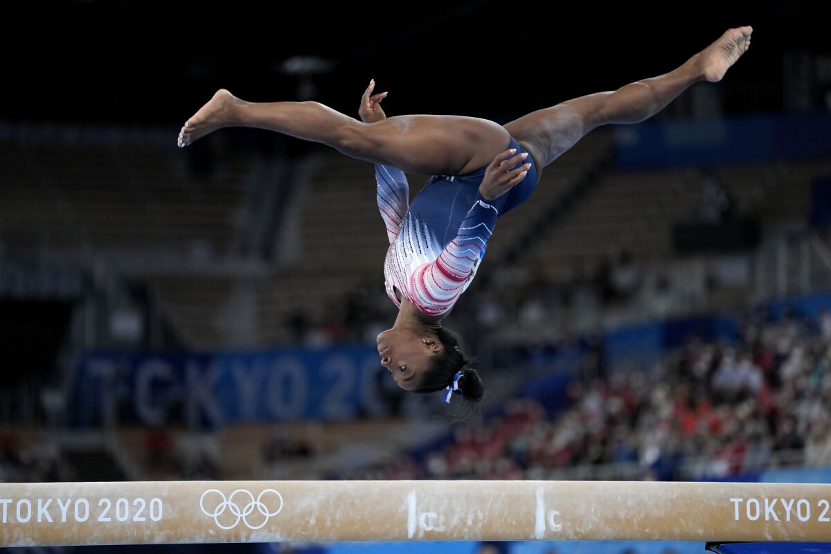 Simone Biles, of the United States, performs on the balance beam 