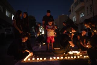 FILE - People light candles in memory of the children and teens killed in a rocket strike at a soccer field at the village of Majdal Shams, in the Israeli-annexed Golan Heights, Sunday, July 28, 2024. (AP Photo/Leo Correa, File)