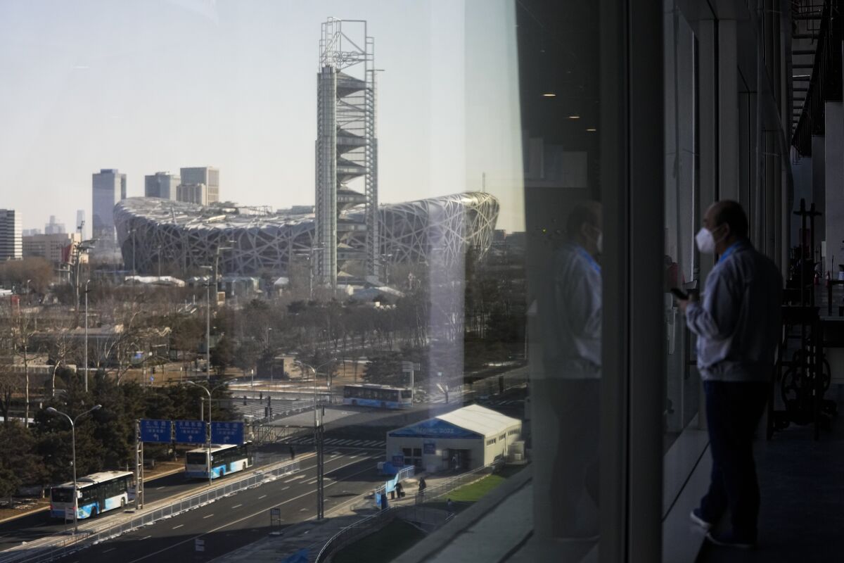 FILE - The Beijing National Stadium, a venue for the opening and closing ceremonies at the 2022 Winter Olympics, is seen from the main media center Jan. 25, 2022, in Beijing. Beijing will become the first city to host both versions of the Games. (AP Photo/Jae C. Hong, File)