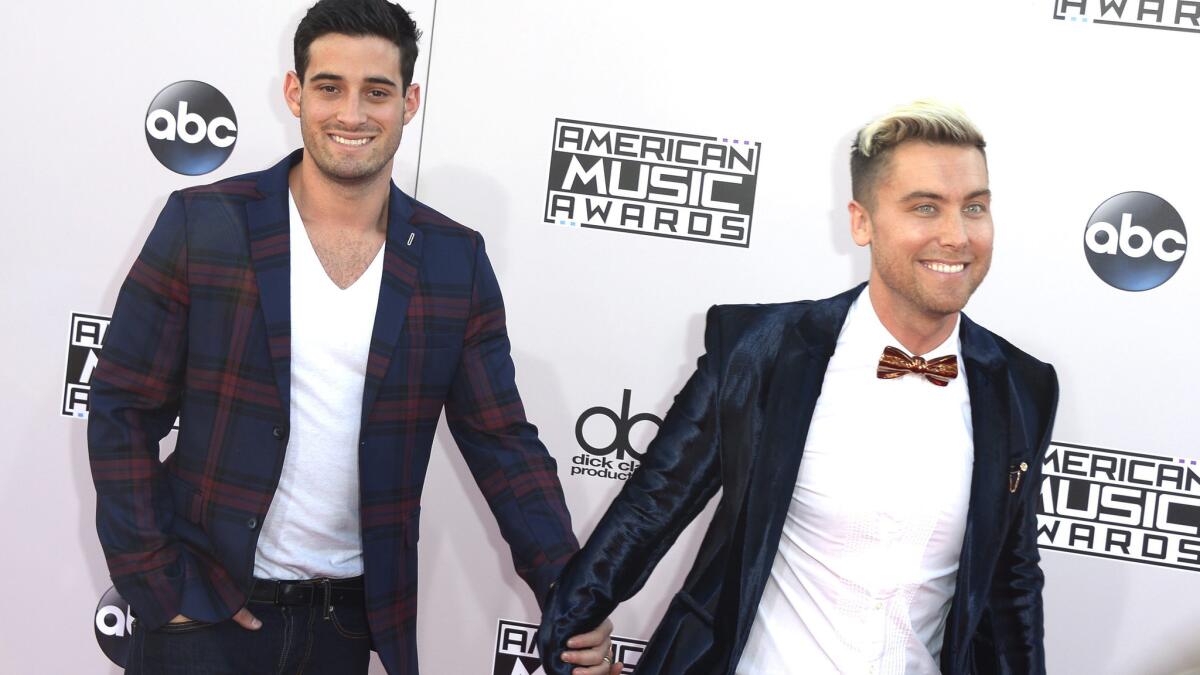 David Turchin, left, and N'Sync veteran Lance Bass -- shown at the American Music Awards in November -- were married Saturday in Los Angeles.