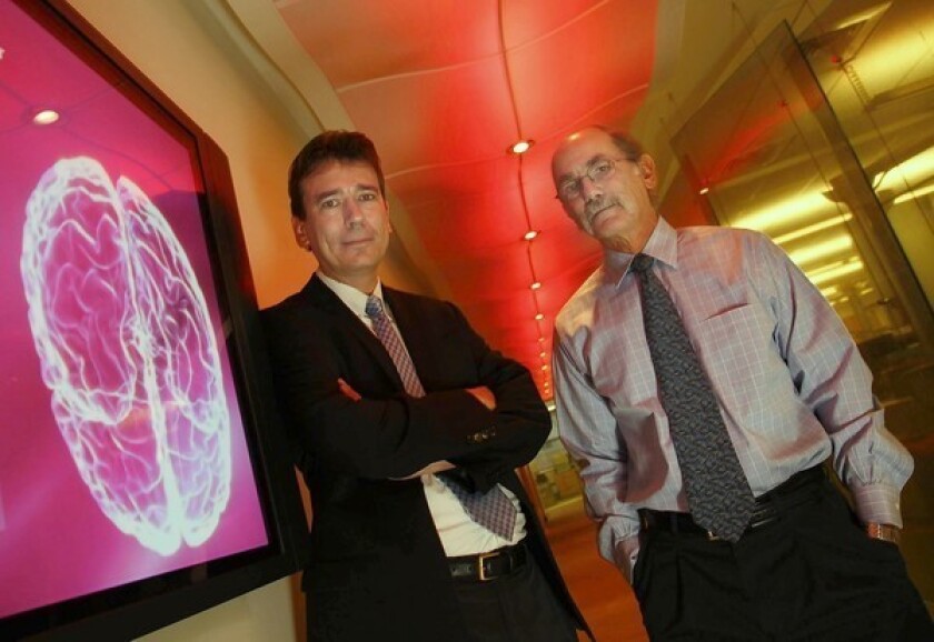 Paul Thompson, left, and Arthur Toga, experts in brain imaging research, are leaving UCLA to join the faculty at USC. They’ll bring with them millions of dollars in annual research funding — not to mention considerable prestige for the Bruins' crosstown rival.