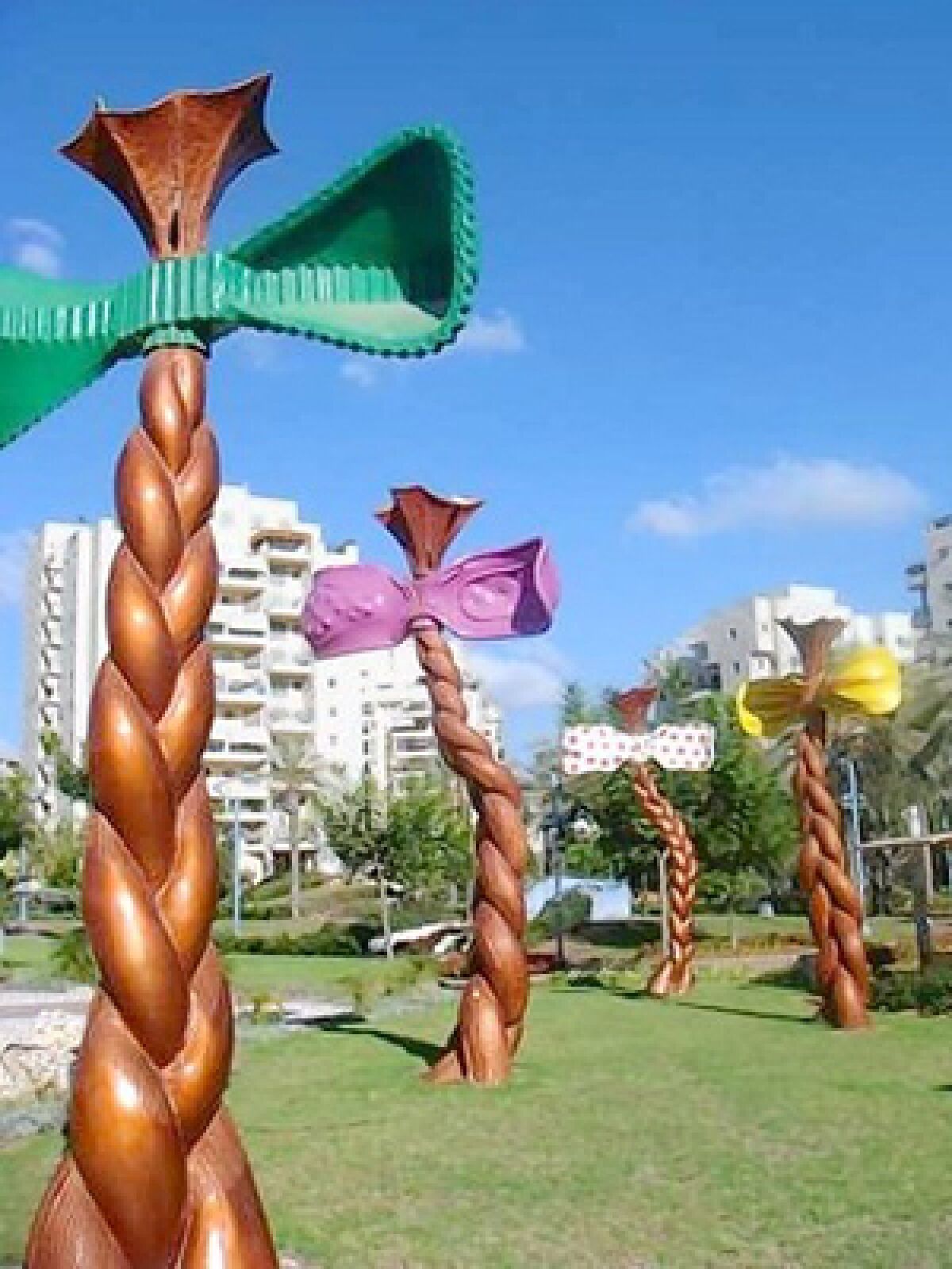 Large sculptures in one of Holon's "Story Gardens," which are public parks that have oversized sculptures that depict famous Israeli fairy tales and children's storie. This one deals with a girl learning to tie her hair in braids.