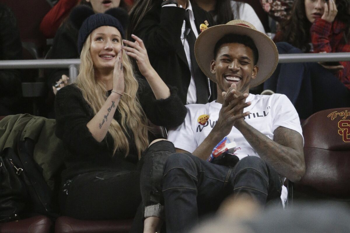 Iggy Azalea and her boyfriend, the Los Angeles Lakers' Nick Young, attend a basketball game between UCLA and USC in January.