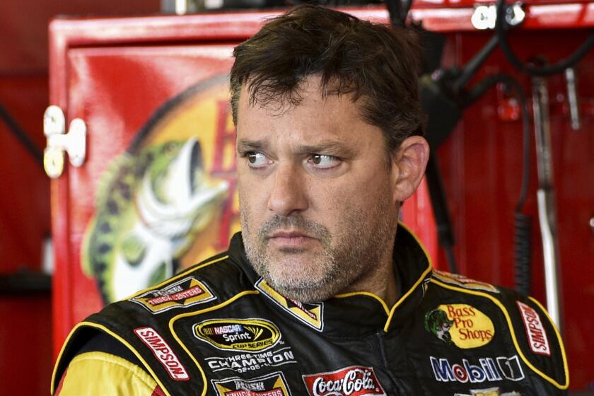 Tony Stewart looks in the garage area during a practice session at Watkins Glen International on Friday.