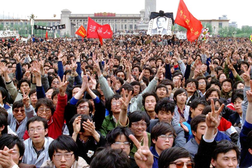 Students shout slogans in support of former Communist Party leader and reformer Hu Yaobang, whose death in April 1989 triggered an unprecedented wave of pro-democracy demonstrations.