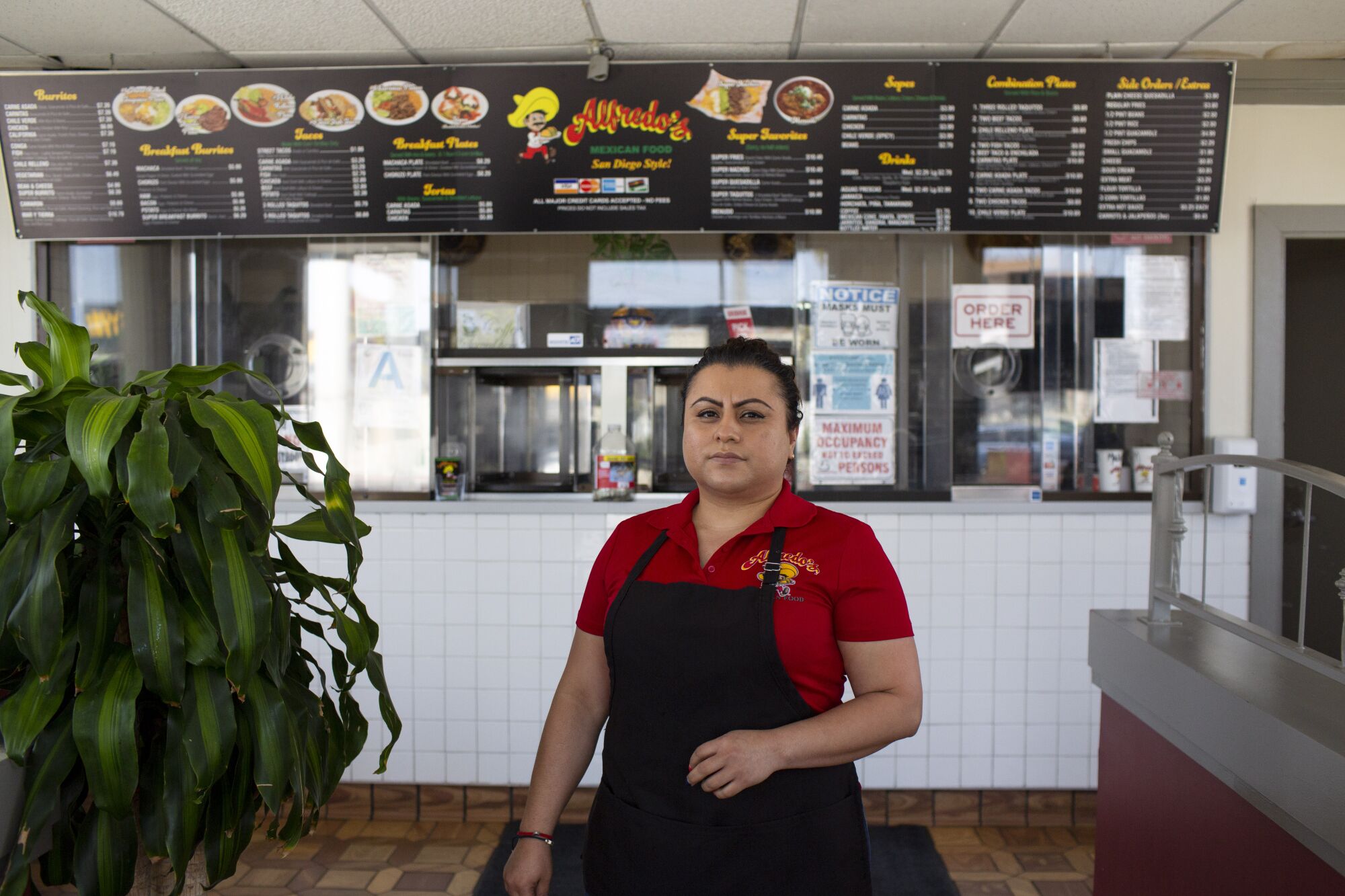 Herminia Reyes stands in front of the order window at Alfredo's Mexican Food
