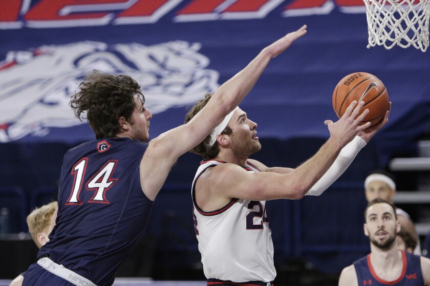Gonzaga forward Corey Kispert shoots in front of Saint Mary's forward Kyle Bowen.