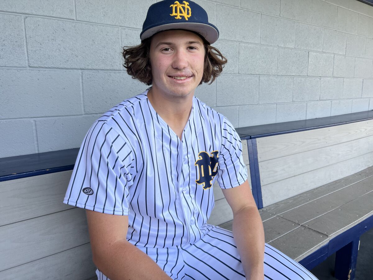 Jack Gurevitch of Sherman Oaks Notre Dame poses for a photo in the dugout.
