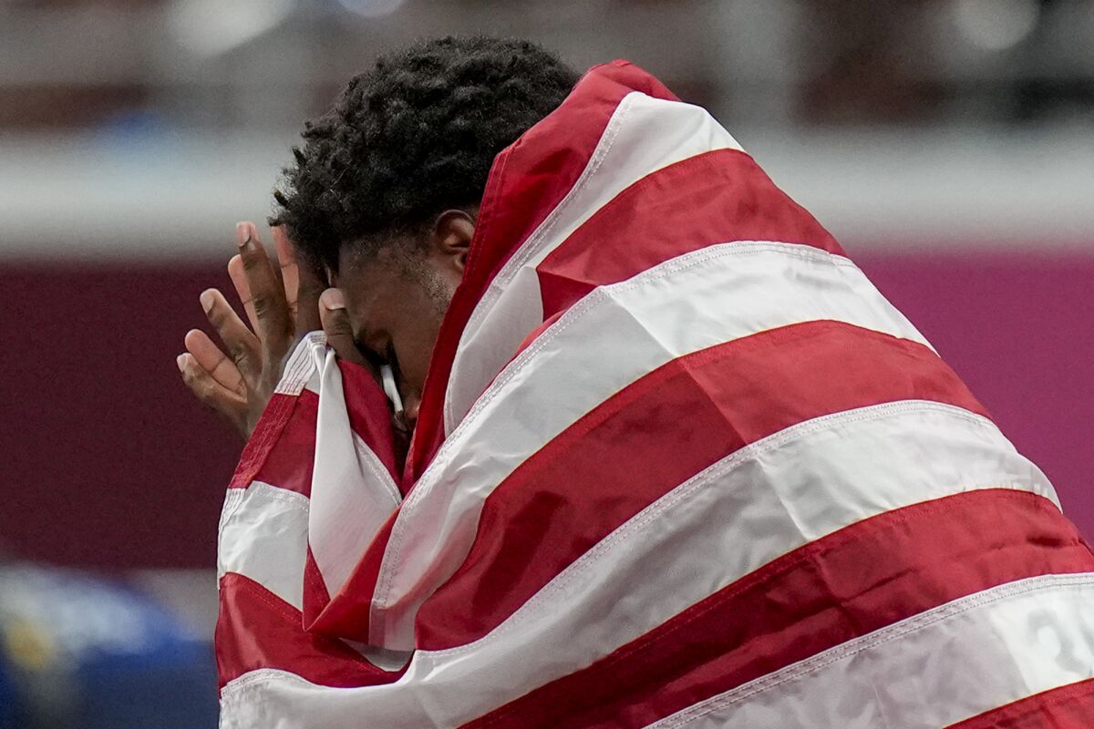 U.S. sprinter Noah Lyles reacts after getting bronze in the men's 200 meters at the Tokyo Olympics.