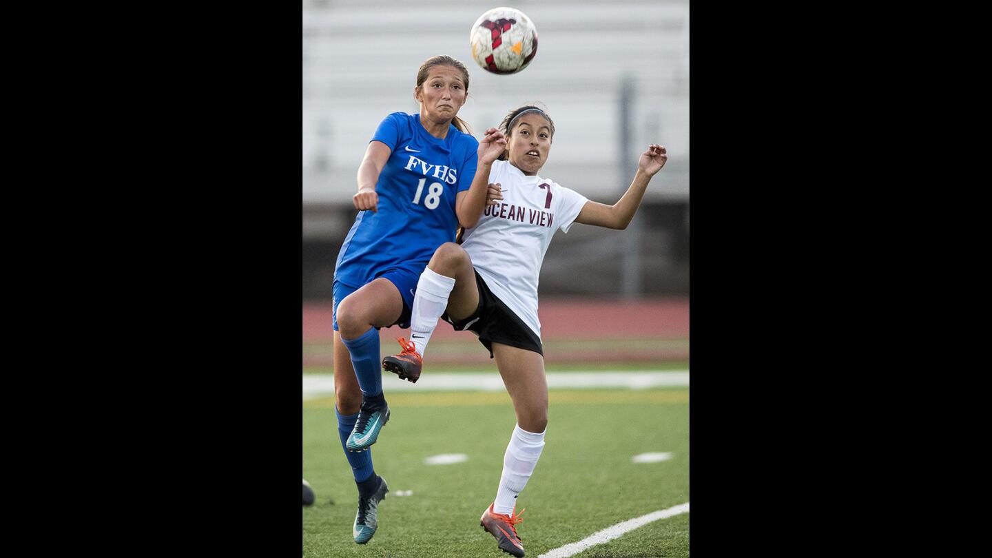 Fountain Valley's Alyssa Rubio goes up for a ball against Ocean View's Emily Cabrera during the Ocean View Winter Tournament on Saturday, December 2.