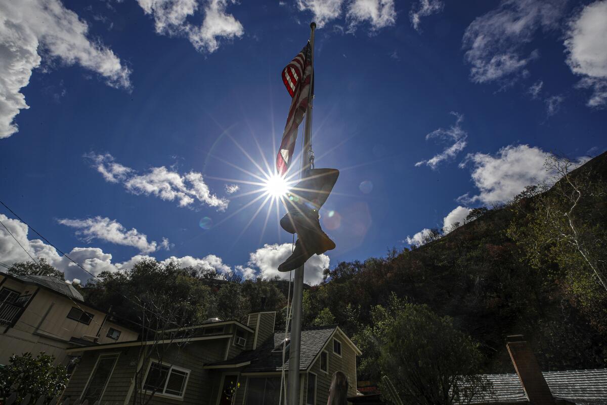 Boots dangle from a flag post along Silverado Canyon Rd