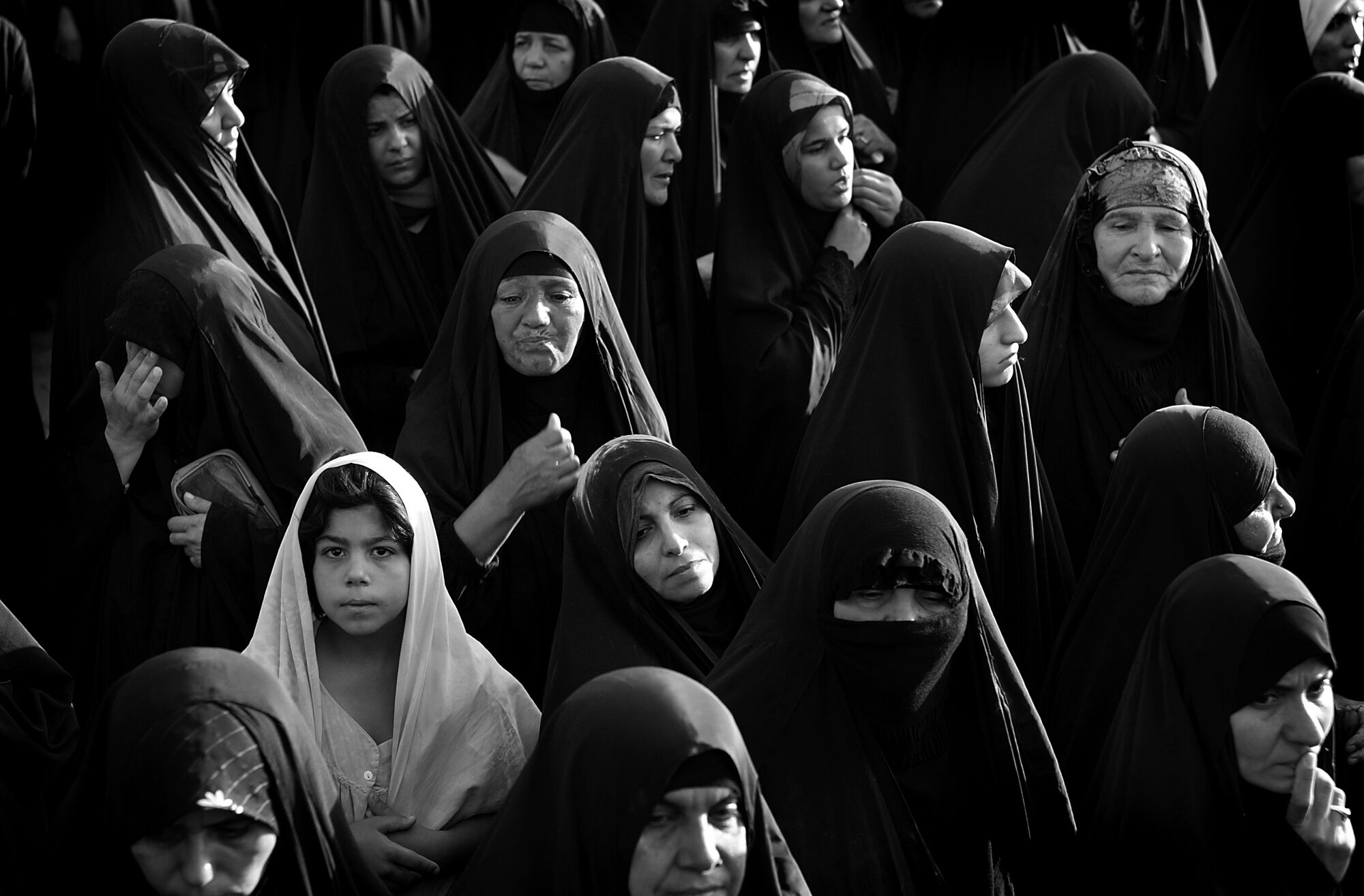 A group of women and girls in head coverings