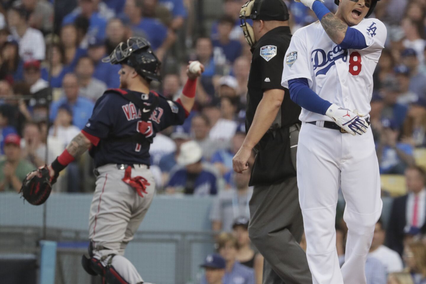 Dodgers Manny Machado reacts after striking out in the first inning.