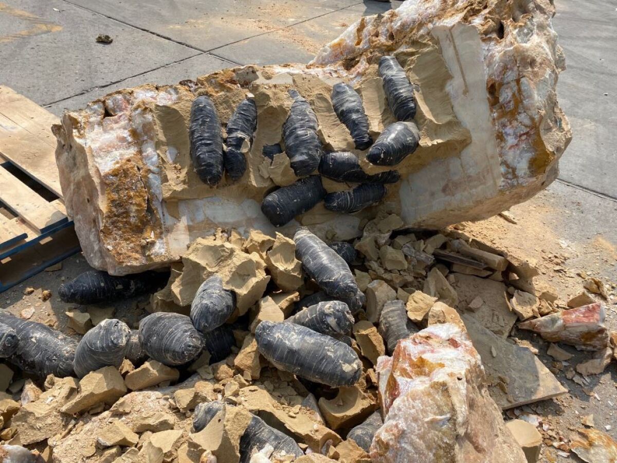 CBP officers found methamphetamine and cocaine, wrapped in electrical tape, cemented inside quartz boulders Monday in Tecate.