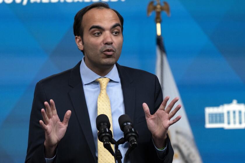 FILE - Consumer Financial Protection Bureau Director Rohit Chopra speaks from the South Court Auditorium on the White House complex in Washington, April 11, 2022. The Consumer Financial Protection Bureau says in a new rule that buy now, pay later lenders are basically credit card providers and must provide the same protections and rights that apply to those lenders. (AP Photo/Jacquelyn Martin, File)