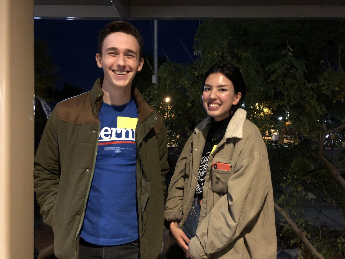 Trevor McMahan, left, and Jane Keranen were strangers before Monday. Keranen, a student at USC, got in touch with the Iowa for Bernie group to see if anyone from the L.A. area would be making the drive out to Palm Springs, and they connected her with McMahan. Together, they made the two-hour drive to caucus for the Vermont senator.