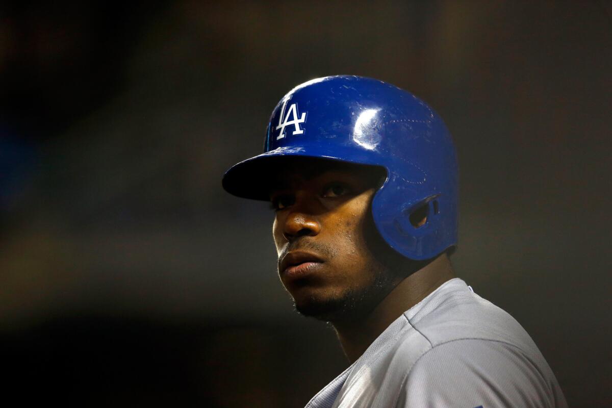 Dodgers outfielder Yasiel Puig looks on during Game 4 of the National League Division Series against the New York Mets on Oct. 13.