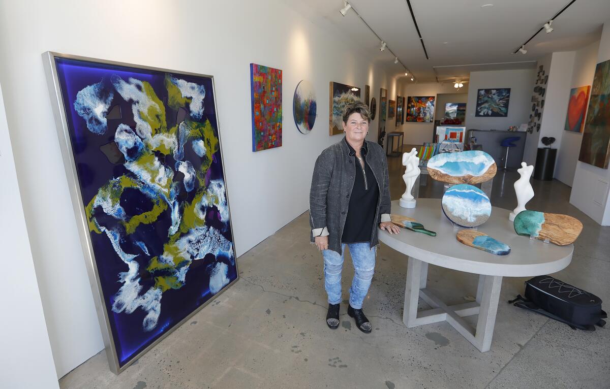 Artist Christie Smith moved from Half Moon Bay in Northern California to open an art gallery in downtown Laguna Beach.