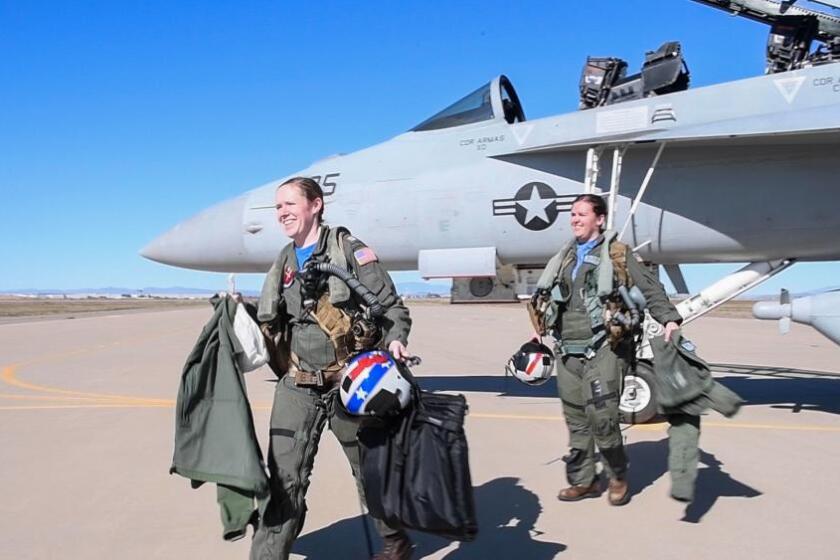 Lt. Lyndsey Evans and Lt. Margaret Dente exit an EA-18G Growler after arriving at Luke Air Force Base, Arizona, Feb. 7, 2023
