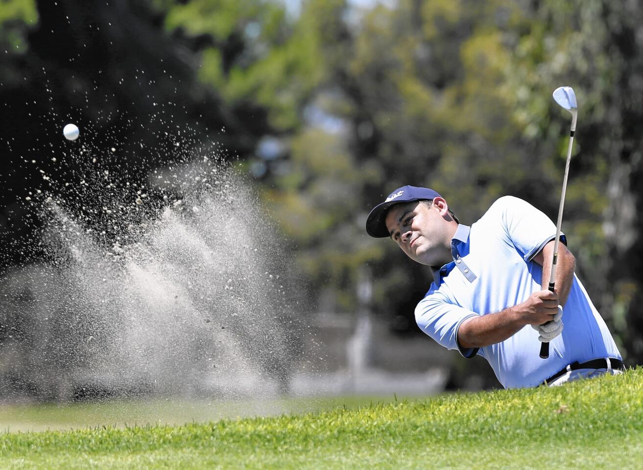 Michael Benvenuti hits out of a sand trap during Saturday's first round of the Costa Mesa City Championship.