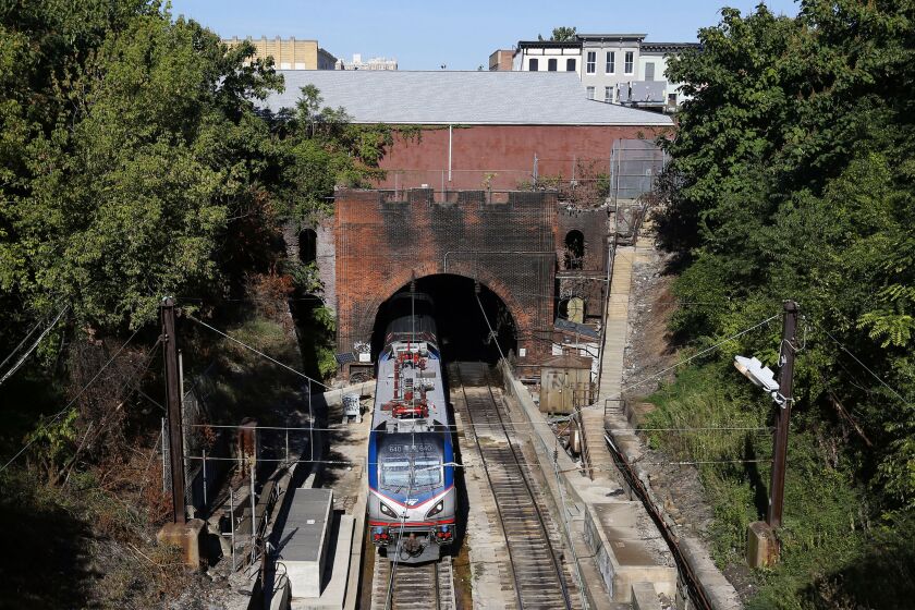 FILE - An Amtrak train emerges from the Baltimore and Potomac Tunnel in Baltimore, Sept. 15, 2015. The tunnel is finally slated to be replaced with help from the $1 trillion bipartisan infrastructure legislation championed by Biden, and he plans to visit on Monday to talk about the massive investment. (AP Photo/Patrick Semansky, File)