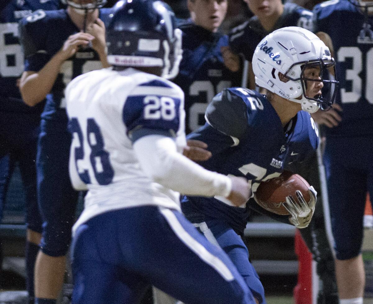Flintridge Prep’s Zach Kim runs the ball during Friday's CIF Southern Section Division I playoff game against PAL Academy at Flintridge Prep. (Photo by Miguel Vasconcellos)