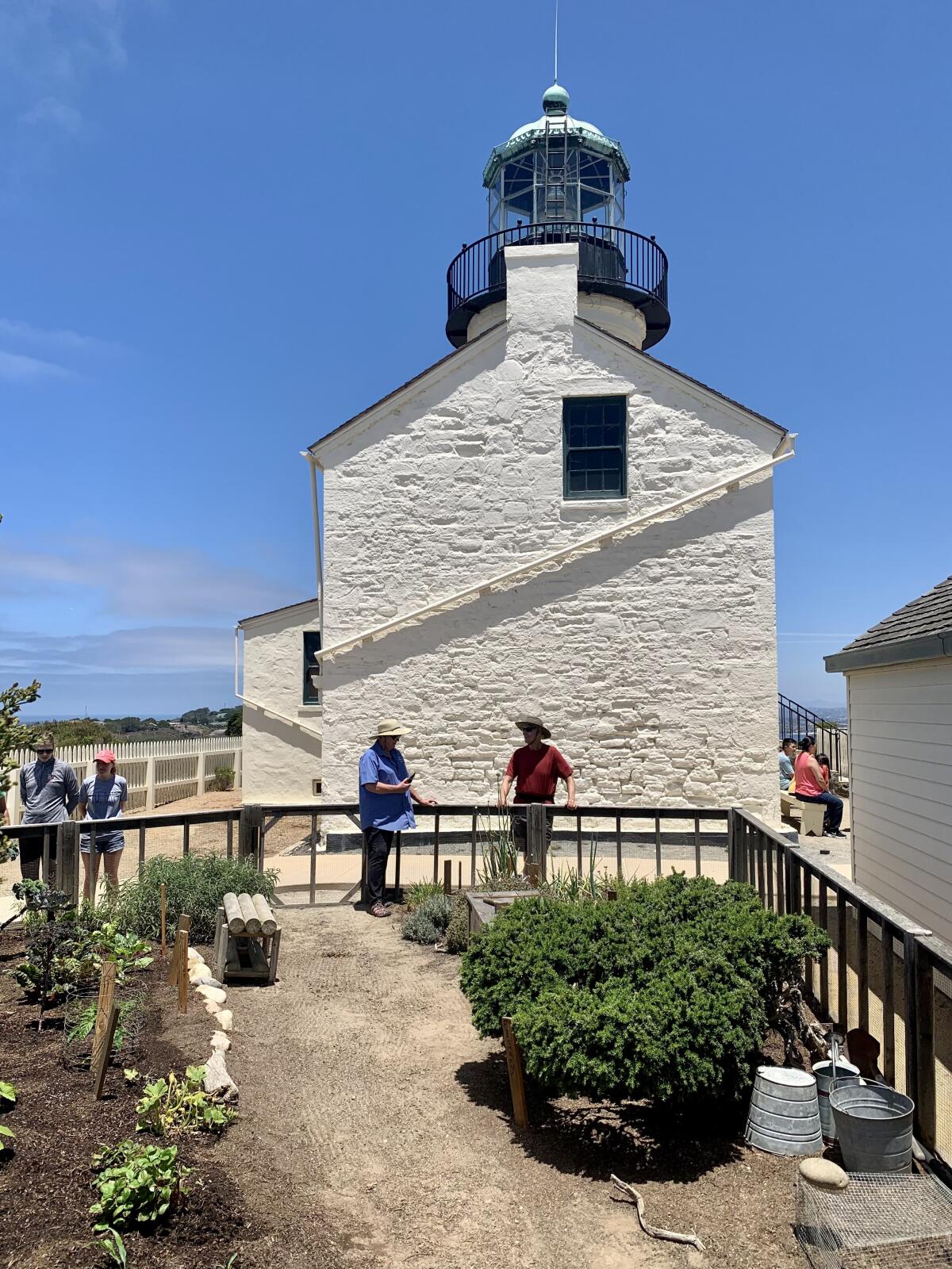 Visitors check out the replica kitchen garden at the lighthouse at Cabrillo National Monument.