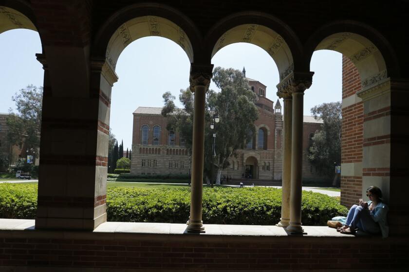 WESTWOOD, CA -- WEDNESDAY, APRIL 13, 2016: A student studies in the archway of Royce Hall at UCLA in Westwood, CA, on April 13, 2016. (Allen J. Schaben / Los Angeles Times)