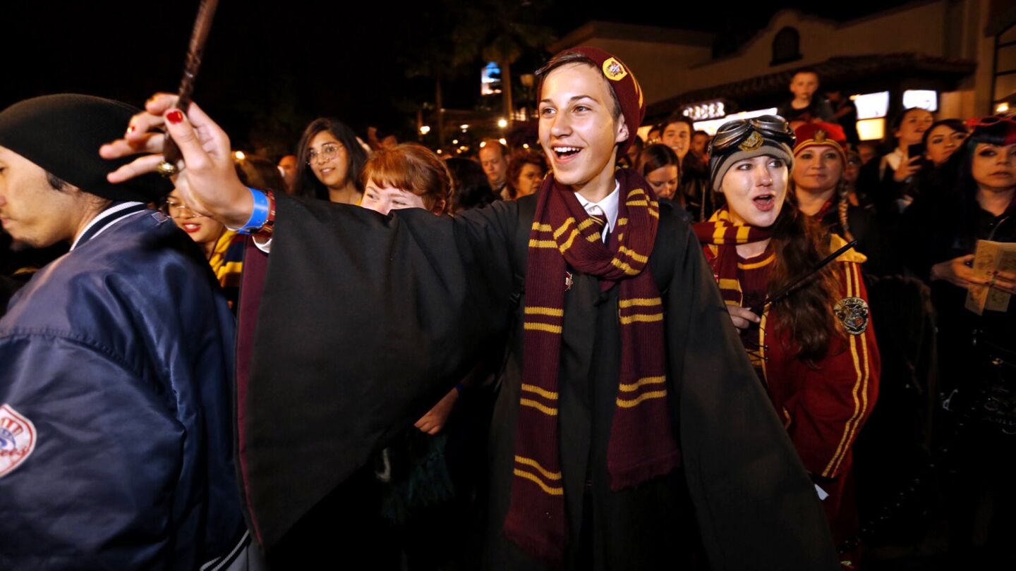 Aidan Jasanis, 14, left, and Katie Aiani, 28, were first and second in line before sunrise April 7, 2016, for the public opening of the Wizarding World of Harry Potter at Universal Studios Hollywood.