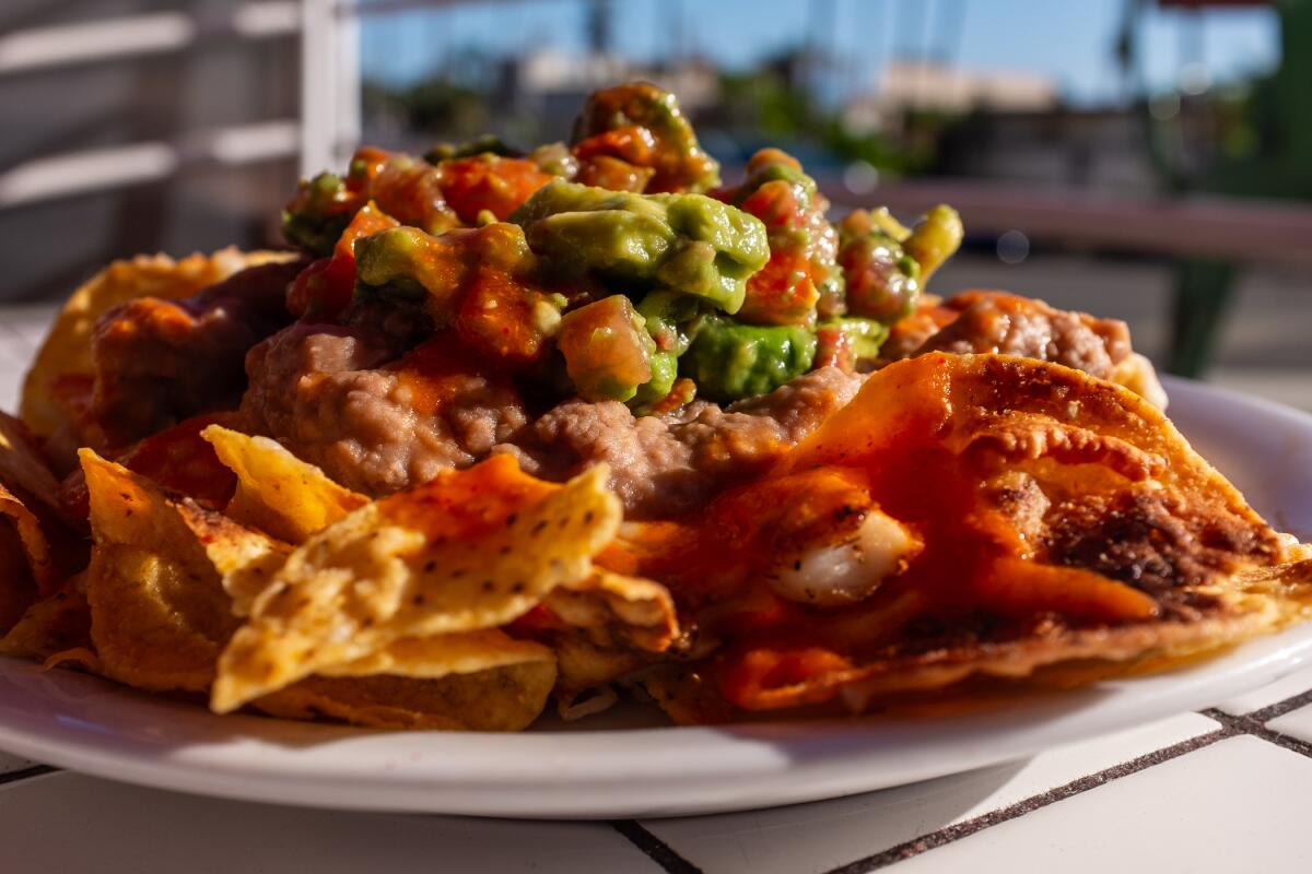 Calamari nachos loaded with beans and guacamole at Taco Loco in Laguna Beach.