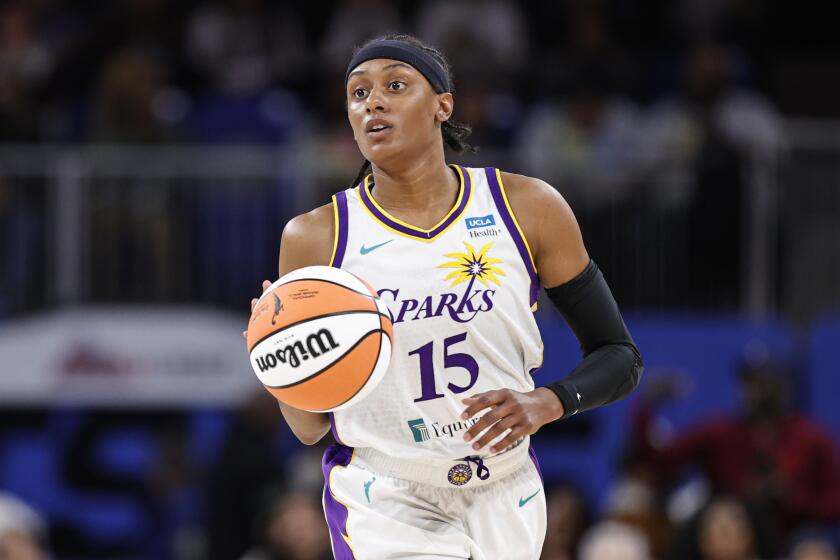 Los Angeles Sparks guard Brittney Sykes brings the ball up court against the Chicago Sky during the first half of the WNBA basketball game, Friday, May 6, 2022, in Chicago. (AP Photo/Kamil Krzaczynski)