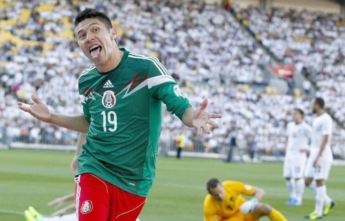 Mexico's Oribe Peralta celebrates a goal against New Zealand during a World Cup qualifying match in Wellington, New Zealand.