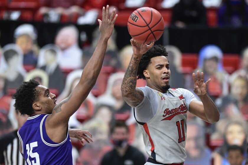 Texas Tech's Kyler Edwards (11) passes the ball during the first half of the team's NCAA college basketball game against TCU in Lubbock, Texas, Tuesday, March 2, 2021. (AP Photo/Justin Rex)