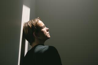 Skater stands in the light for a really nice emotional portrait