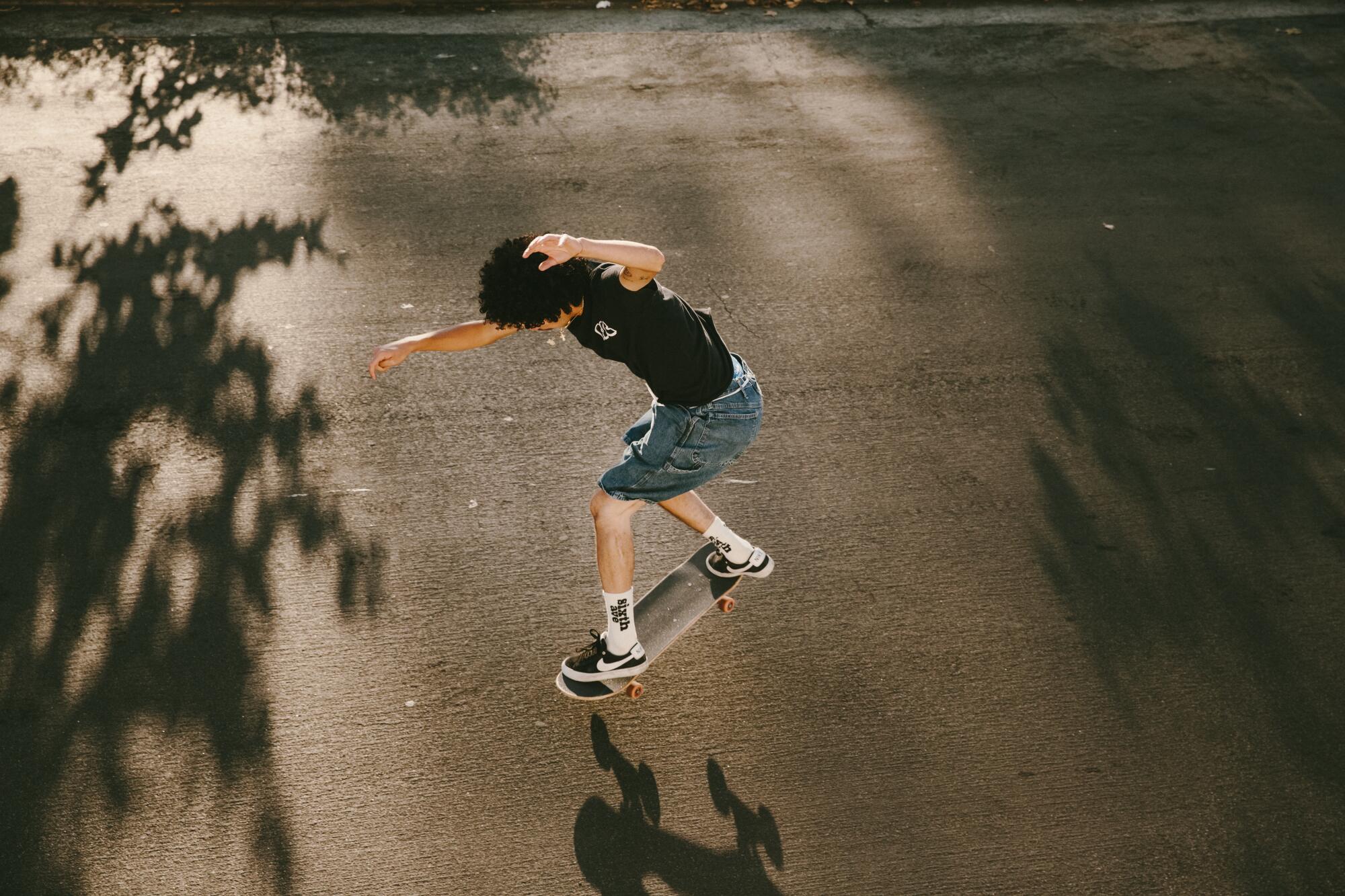 Jon Alamilla wears CSC OG Logo Tee in Black, $30