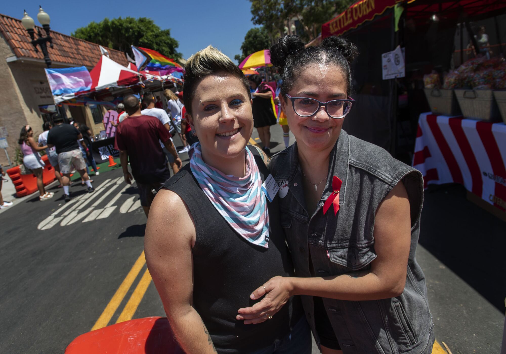 Rowan Hepps Keeney, left, and her partner, Yashia Garcia, at the festival in Santa Ana.