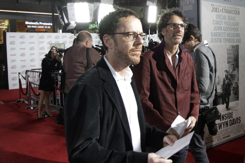 Joel and Ethan Coen will reportedly write the screenplay for a Steven Spielberg-directed Cold War thriller starring Tom Hanks. Above, the filmmaker brothers, with Ethan at left, at the premiere last fall of "Inside Llewyn Davis."