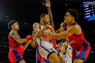 Houston, TX - April 1: San Diego State Aztecs forward Keshad Johnson comes down with a rebound during the first half of the semifinal round of the 2023 NCAA Men's Basketball Tournament played between the San Diego State Aztecs and the Florida Atlantic Owls at NRG Stadium on Saturday, April 1, 2023 in Houston, TX. (K.C. Alfred / The San Diego Union-Tribune)