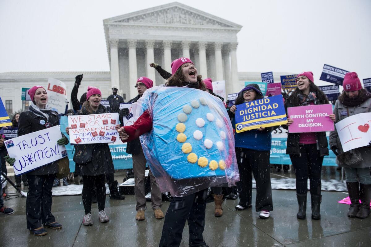 Who will make the decision under single-payer? Women's rights activists demonstrate in front of the Supreme Court during arguments in the Hobby Lobby case on March 25.