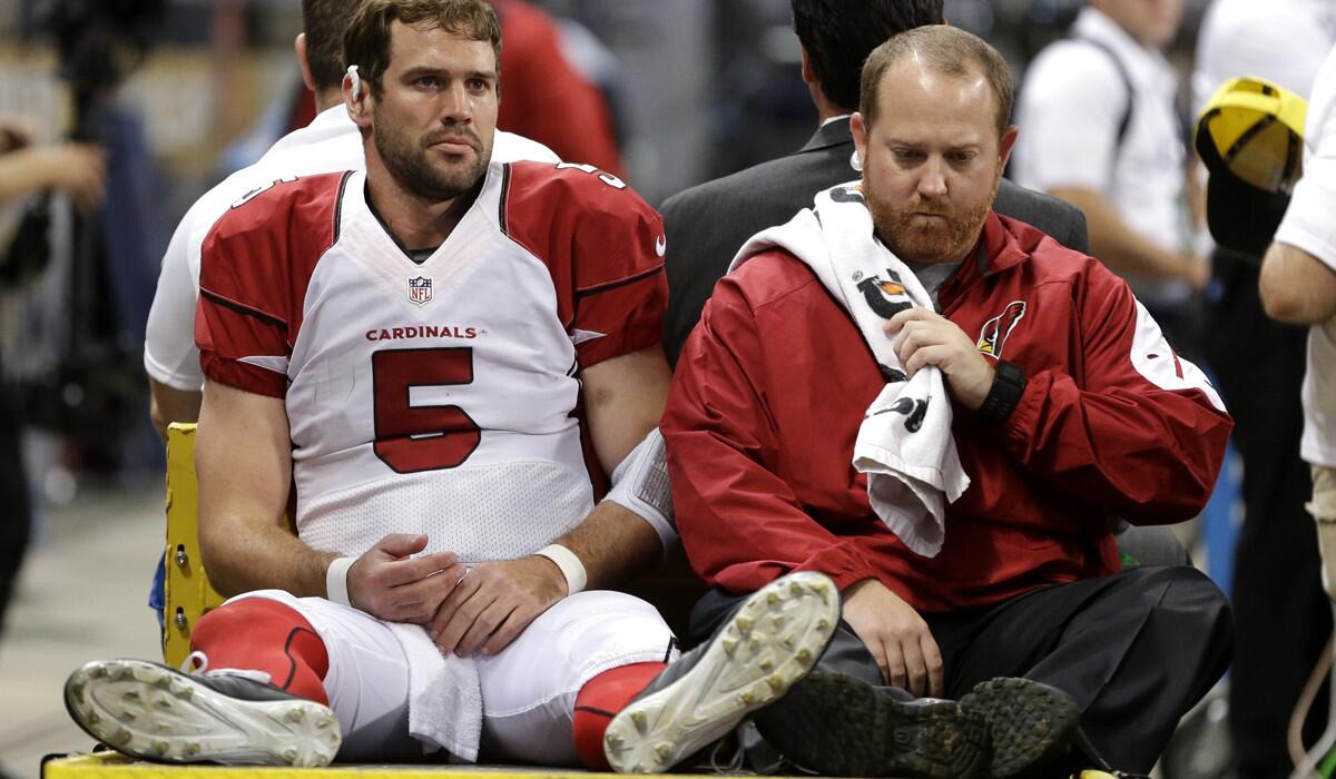Cardinals quarterback Drew Stanton leaves the field after injuring his right knee in the second half of a game against the Rams on Thursday night in St. Louis.