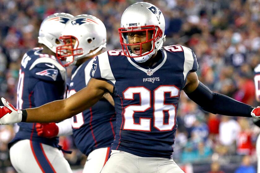 Patriots defensive back Logan Ryan celebrates after intercepting a pass by Dolphins quarterback Ryan Tannehill in the second quarter Thursday night.
