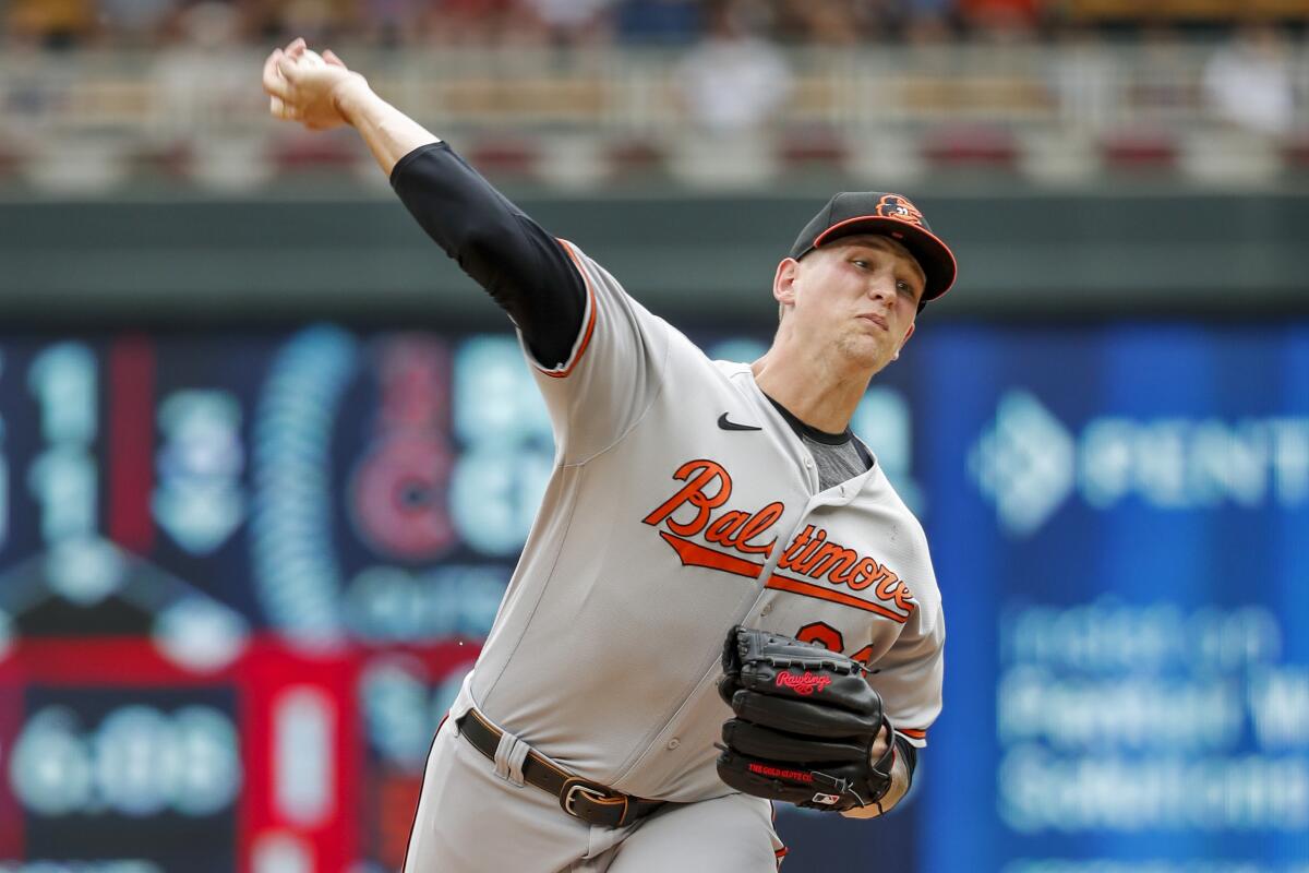 Baltimore Orioles starting pitcher Tyler Wells throws to the Minnesota Twins in the second inning of a baseball game, Sunday, July 3, 2022, in Minneapolis. (AP Photo/Bruce Kluckhohn)
