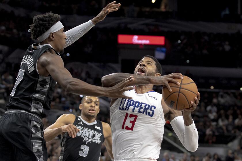 Los Angeles Clippers guard Paul George (13) drives against San Antonio Spurs guard Josh Richardson.