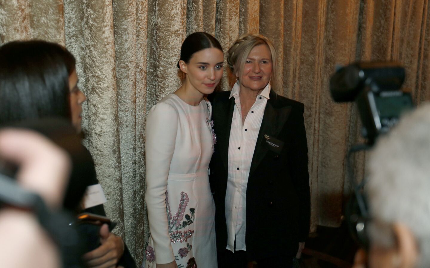 Rooney Mara, left, and costume designer Jacqueline West pose for pictures at the luncheon.