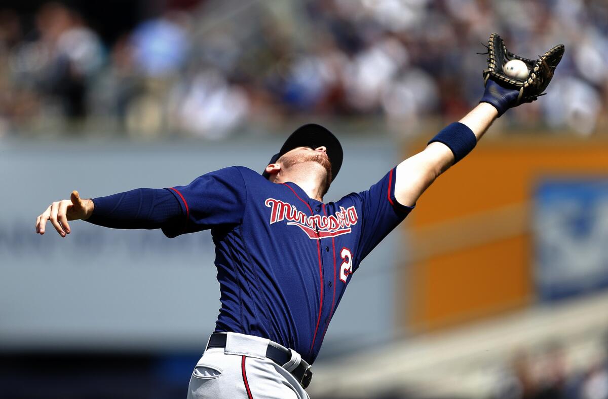 Former Angel C.J. Cron makes a tough catch for the Twins during a game against the New York Yankees on May 4.
