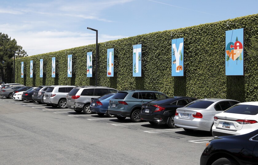 Panels spelling "community" adorn the parking lot of the CAMP retail campus in Costa Mesa. 